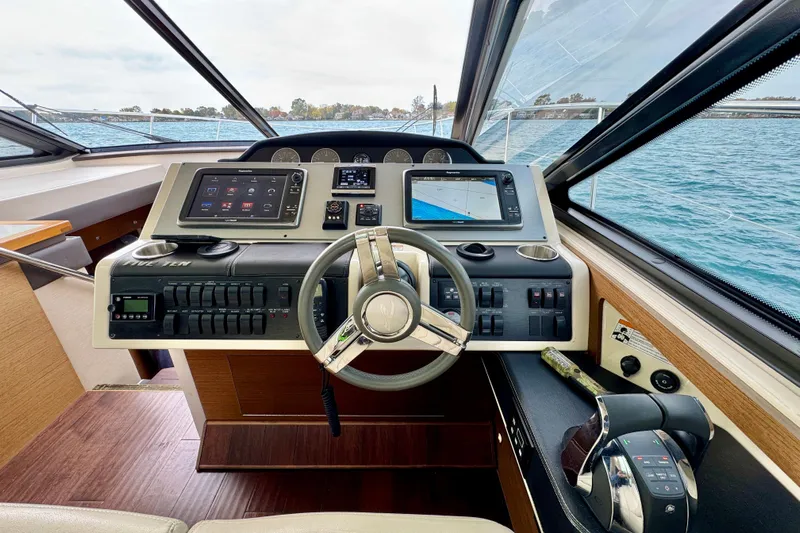 Floor It Yacht Photos Pics Helm of 2014 Sea Ray 510 Sundancer yacht with modern navigation controls.