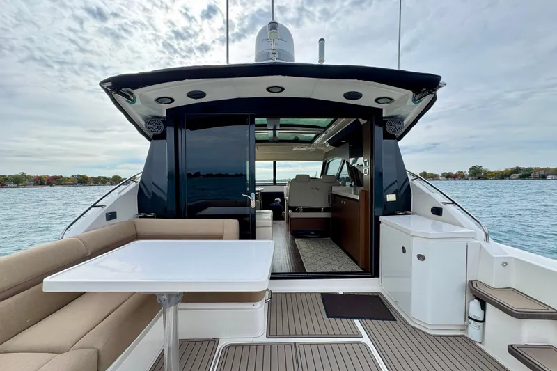 Floor It Yacht Photos Pics 2014 Sea Ray 510 Sundancer yacht with open deck and luxurious interior on a calm lake.