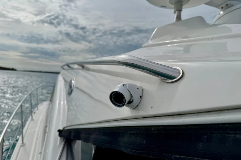 Floor It Yacht Photos Pics 2014 Sea Ray 510 Sundancer yacht with camera, cruising on a sunny day.