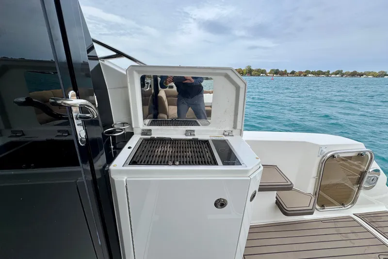 Floor It Yacht Photos Pics 2014 Sea Ray 510 Sundancer yacht with outdoor grill and scenic water view.