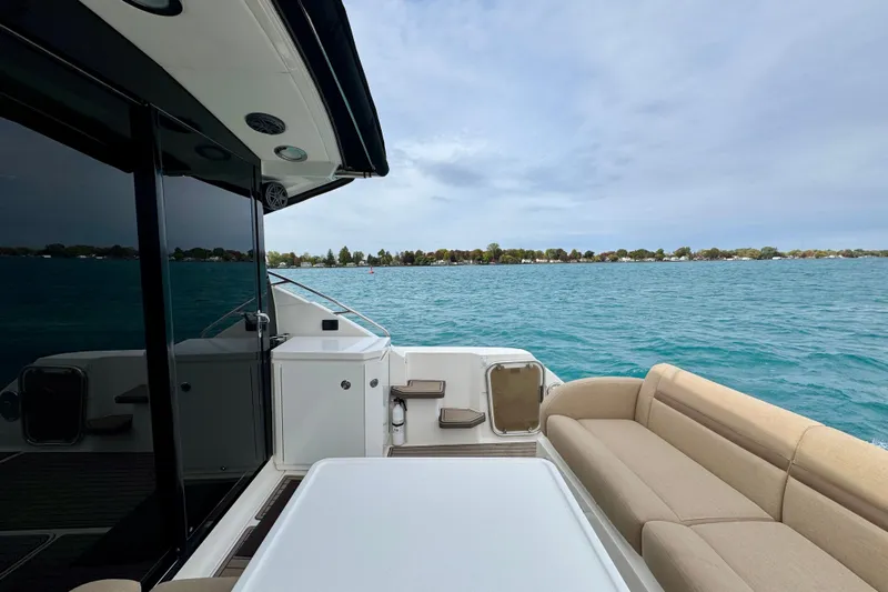 Floor It Yacht Photos Pics 2014 Sea Ray 510 Sundancer yacht with spacious deck and scenic water view.