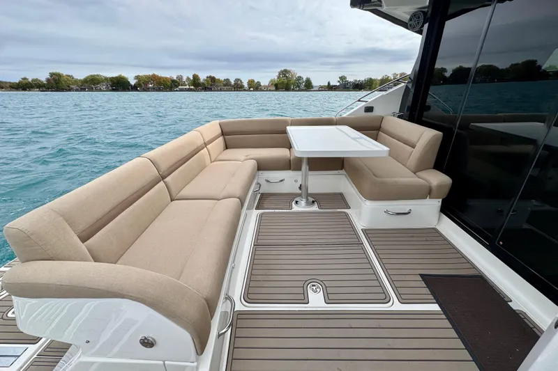 Floor It Yacht Photos Pics Luxurious 2014 Sea Ray 510 Sundancer yacht with spacious outdoor seating and table.
