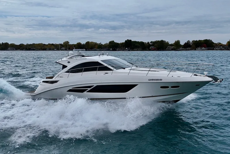Floor It Yacht Photos Pics 2014 Sea Ray 510 Sundancer yacht cruising on open water, showcasing sleek design and luxury.