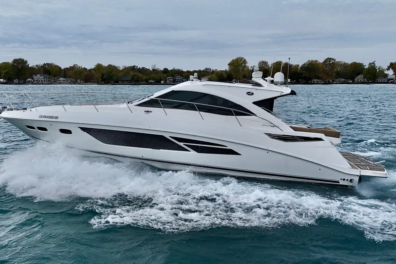 Floor It Yacht Photos Pics 2014 Sea Ray 510 Sundancer yacht cruising on a scenic waterway.
