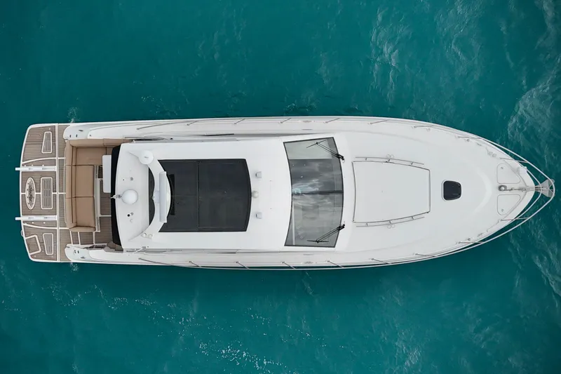 Floor It Yacht Photos Pics Overhead view of 2014 Sea Ray 510 Sundancer yacht on turquoise water.