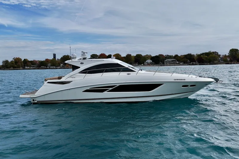 Floor It Yacht Photos Pics 2014 Sea Ray 510 Sundancer yacht cruising on a serene blue lake.
