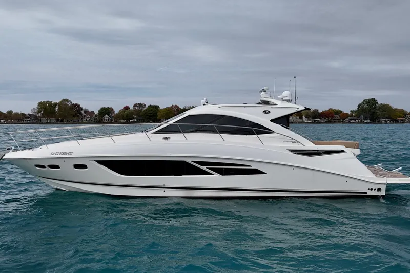 Floor It Yacht Photos Pics 2014 Sea Ray 510 Sundancer yacht on blue water, side view.