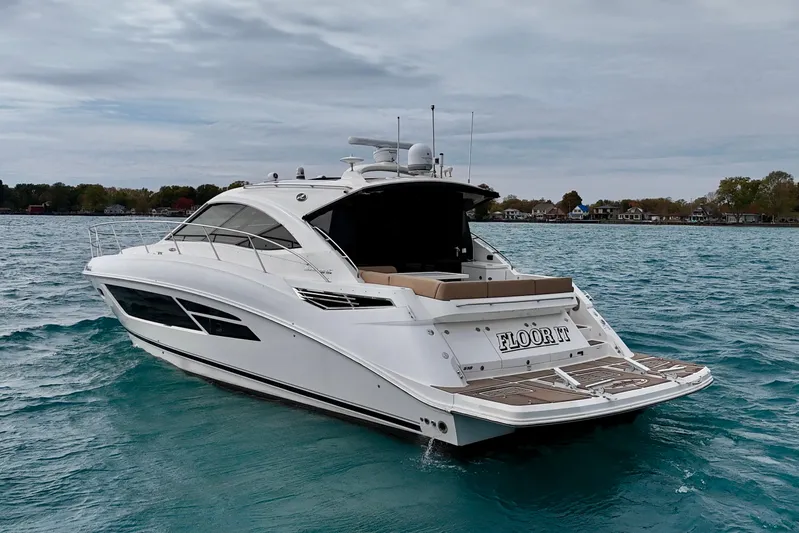 Floor It Yacht Photos Pics 2014 Sea Ray 510 Sundancer yacht cruising on a calm, blue lake.
