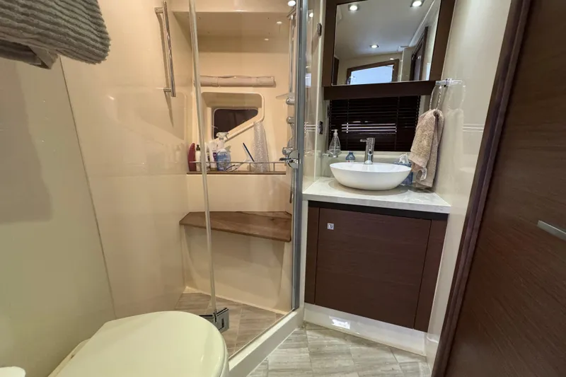 Floor It Yacht Photos Pics Luxurious bathroom in 2014 Sea Ray 510 Sundancer yacht with modern fixtures.
