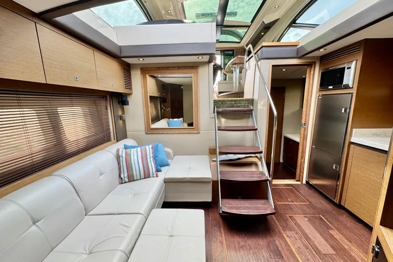Floor It Yacht Photos Pics Luxurious interior of 2014 Sea Ray 510 Sundancer yacht with modern furnishings and skylights.