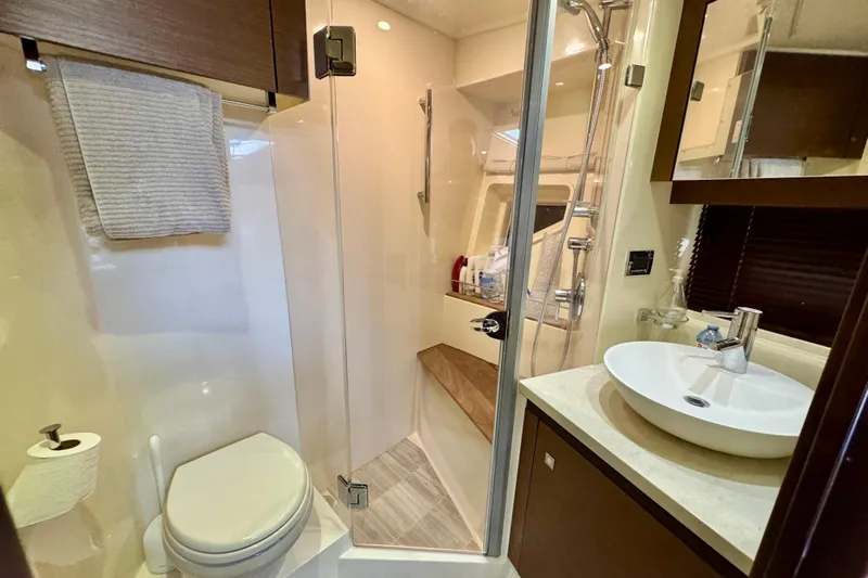 Floor It Yacht Photos Pics Luxurious bathroom in 2014 Sea Ray 510 Sundancer yacht with modern fixtures.