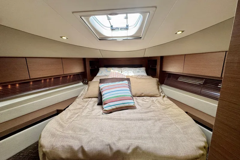 Floor It Yacht Photos Pics Luxurious cabin interior of 2014 Sea Ray 510 Sundancer yacht with cozy bedding.