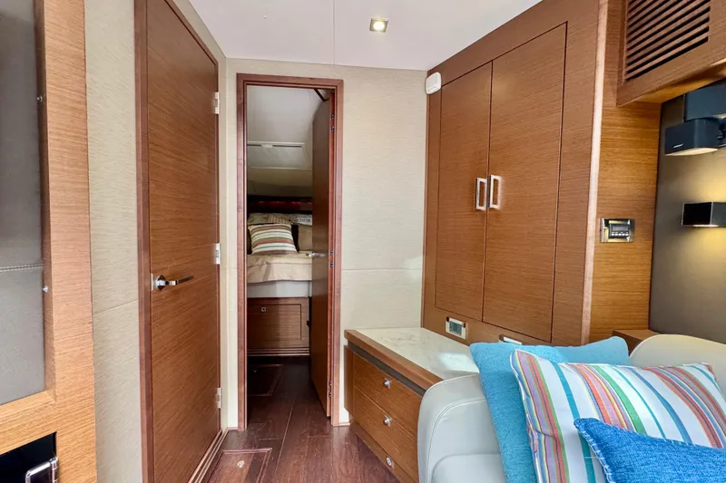 Floor It Yacht Photos Pics Interior of 2014 Sea Ray 510 Sundancer yacht with wood finishes and cozy cabin.