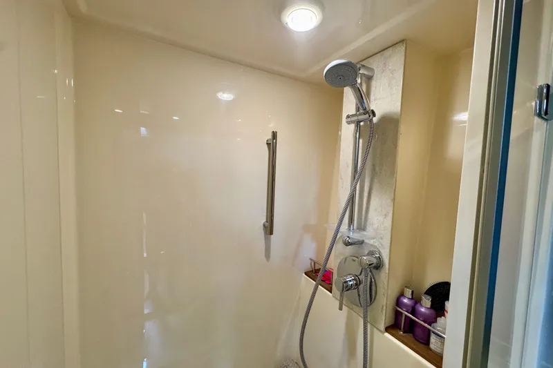 Floor It Yacht Photos Pics Shower area in 2014 Sea Ray 510 Sundancer yacht with modern fixtures and toiletries.