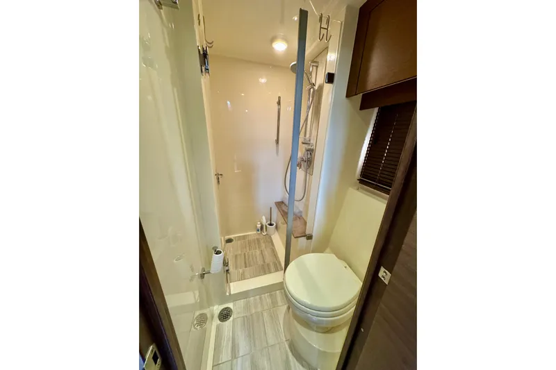 Floor It Yacht Photos Pics Luxurious bathroom in 2014 Sea Ray 510 Sundancer yacht with shower and toilet.