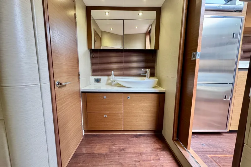 Floor It Yacht Photos Pics Luxurious bathroom interior of 2014 Sea Ray 510 Sundancer yacht with modern fixtures.