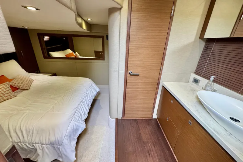 Floor It Yacht Photos Pics Luxurious interior of 2014 Sea Ray 510 Sundancer yacht with bedroom and bathroom.