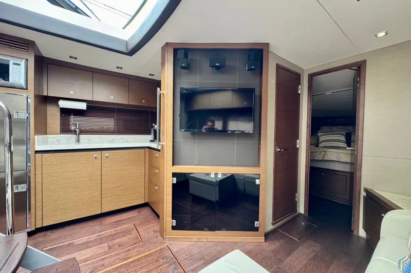 Floor It Yacht Photos Pics Luxurious interior of 2014 Sea Ray 510 Sundancer yacht with modern kitchen and entertainment area.