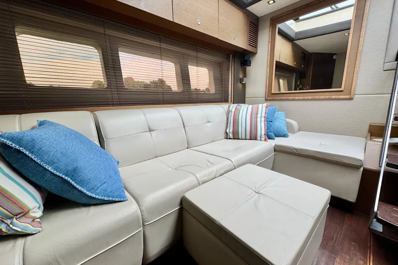 Floor It Yacht Photos Pics Luxurious interior of 2014 Sea Ray 510 Sundancer yacht with plush seating and decorative pillows.