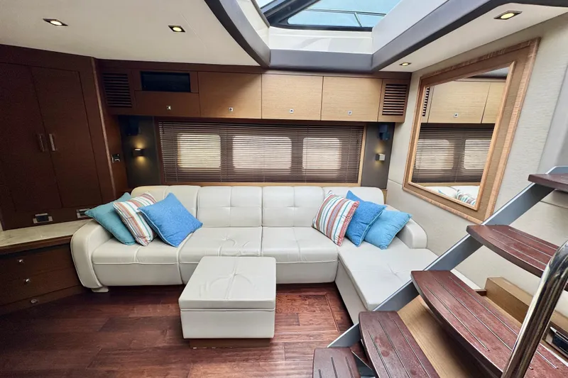 Floor It Yacht Photos Pics Luxurious interior of 2014 Sea Ray 510 Sundancer yacht with plush seating and modern decor.