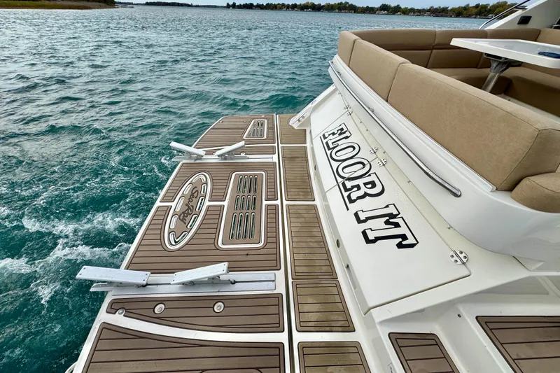 Floor It Yacht Photos Pics 2014 Sea Ray 510 Sundancer boat with teak deck and "Floor It" text on the stern.