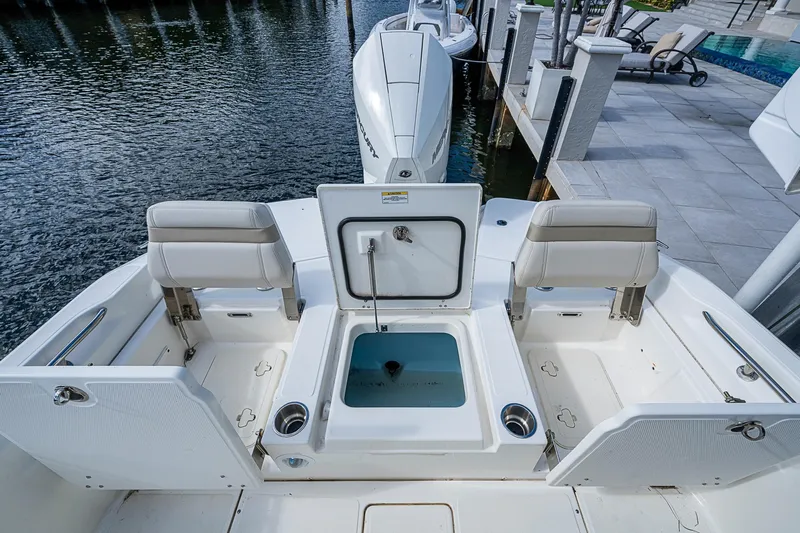  Yacht Photos Pics 2023 Boston Whaler 250 Dauntless boat interior with seating and storage compartments.