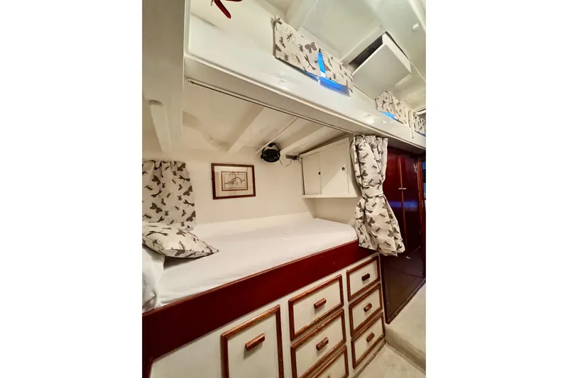 Barinia Yacht Photos Pics 1950 MOLLICH Sailing boat interior with cozy bunk bed and storage drawers.