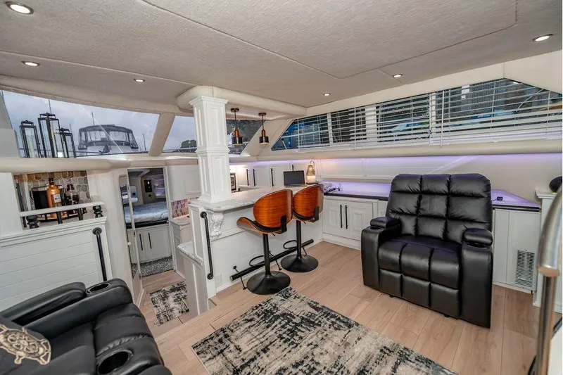 Bada Bing Yacht Photos Pics Luxurious interior of 1991 Cruisers Yachts 3850 Aft Cabin with modern seating and decor.