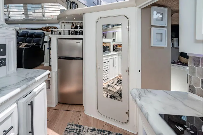 Bada Bing Yacht Photos Pics Luxurious 1991 Cruisers Yachts 3850 Aft Cabin interior with modern kitchen and elegant design.