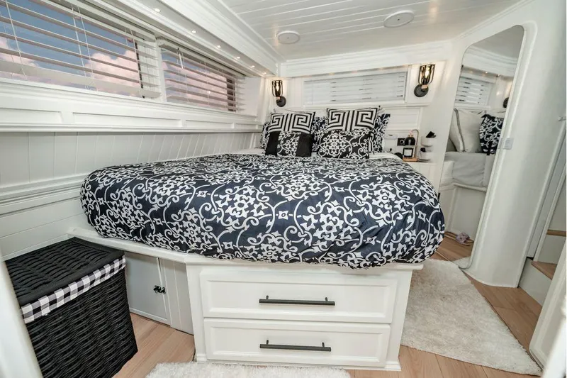 Bada Bing Yacht Photos Pics Luxurious 1991 Cruisers Yachts 3850 Aft Cabin bedroom with elegant bedding and modern decor.