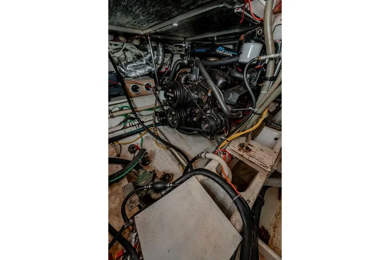 Bada Bing Yacht Photos Pics Engine room of 1991 Cruisers Yachts 3850 Aft Cabin with visible wiring and components.