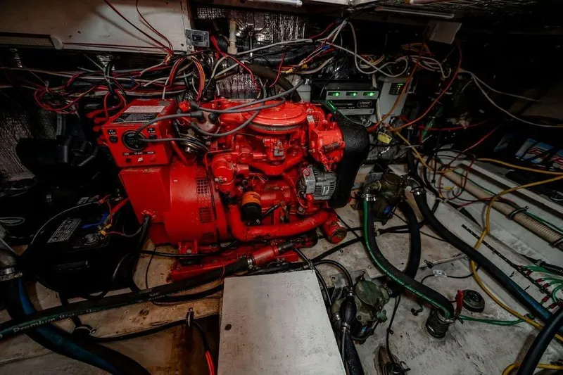 Bada Bing Yacht Photos Pics Engine room of 1991 Cruisers Yachts 3850 Aft Cabin with red engine and wiring.