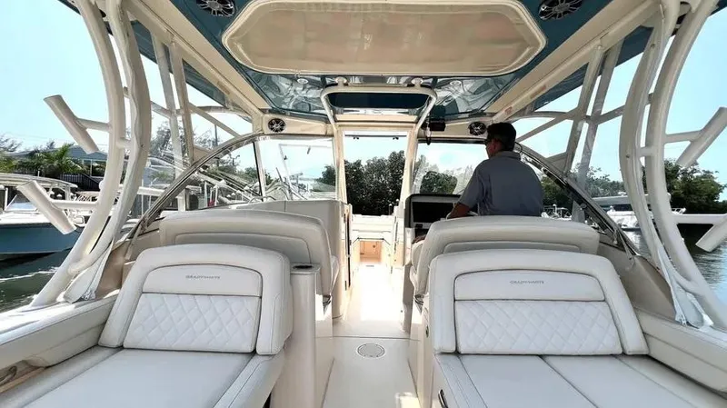  Yacht Photos Pics 2019 Grady-White Freedom 325 boat interior with luxurious seating and helm.