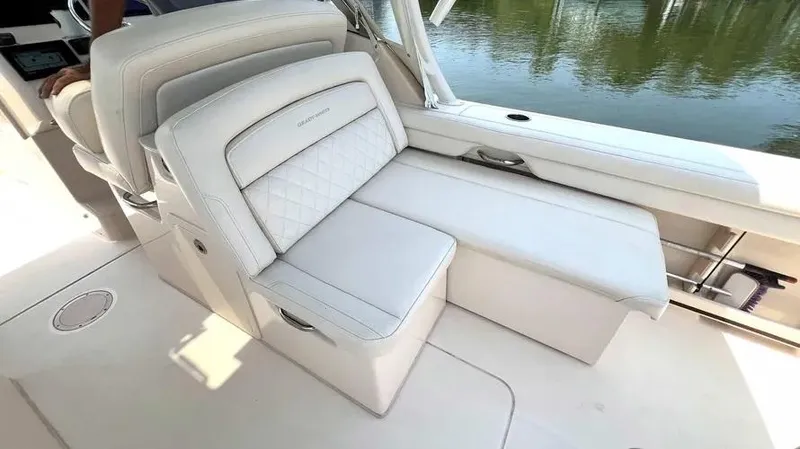  Yacht Photos Pics 2019 Grady-White Freedom 325 boat interior with luxurious white seating.