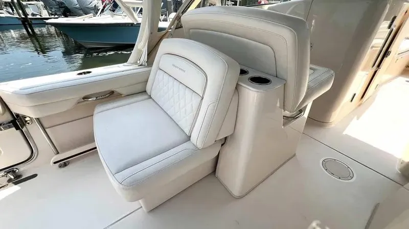  Yacht Photos Pics 2019 Grady-White Freedom 325 boat interior with luxurious seating and cup holders.