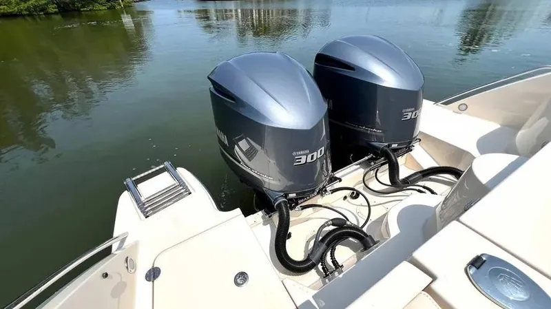  Yacht Photos Pics 2019 Grady-White Freedom 325 boat with twin 300 horsepower outboard engines on calm water.
