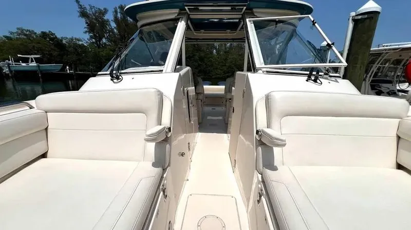  Yacht Photos Pics 2019 Grady-White Freedom 325 boat interior with white seating and clear skies.