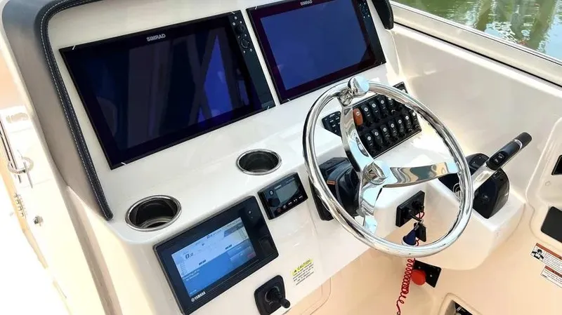  Yacht Photos Pics 2019 Grady-White Freedom 325 helm with dual displays and modern controls.