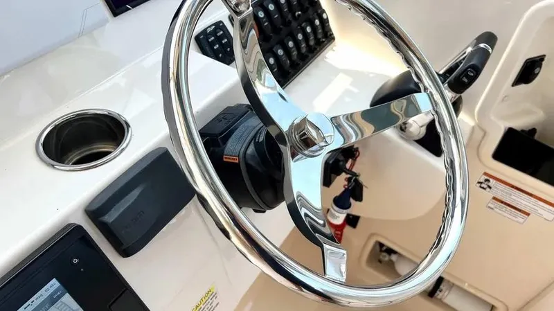  Yacht Photos Pics Steering wheel of 2019 Grady-White Freedom 325 boat, featuring modern controls and design.