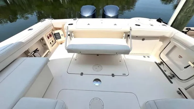  Yacht Photos Pics 2019 Grady-White Freedom 325 boat interior with seating and storage compartments.