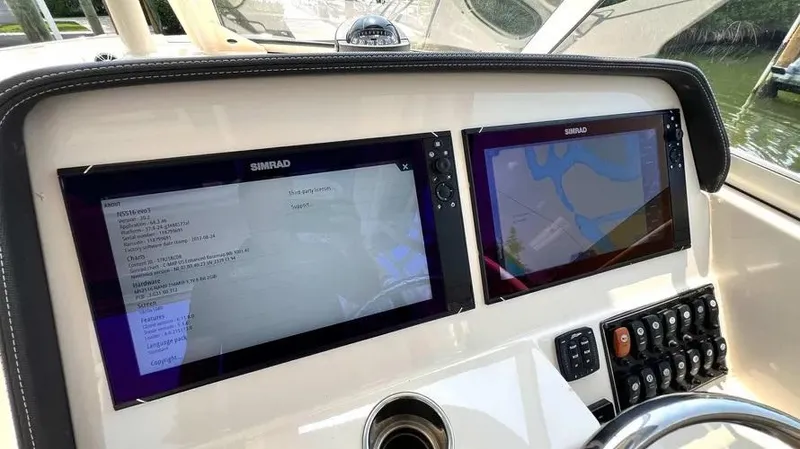  Yacht Photos Pics 2019 Grady-White Freedom 325 dashboard with dual Simrad displays and control panel.