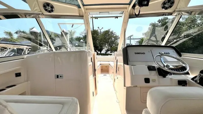  Yacht Photos Pics 2019 Grady-White Freedom 325 boat interior with modern dashboard and seating.