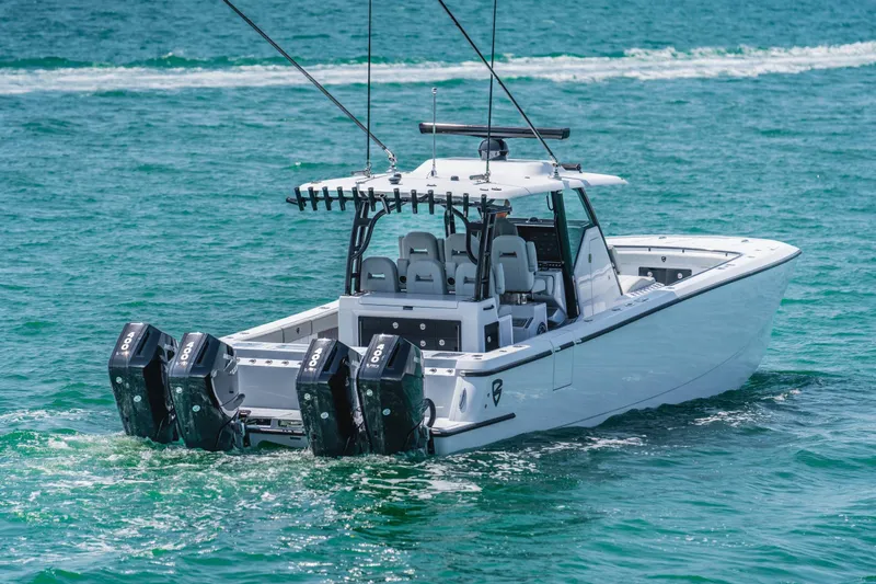  Yacht Photos Pics 2026 Barker Boatworks 40HPC with quad engines cruising on clear blue water.