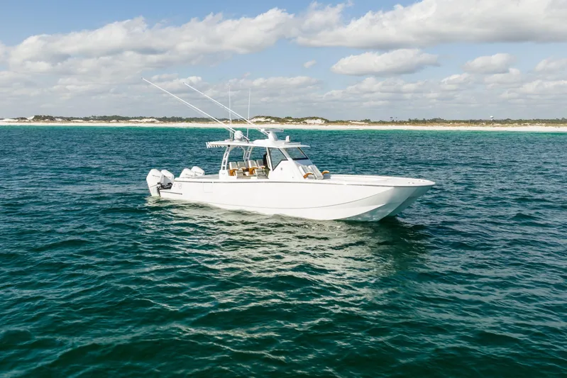  Yacht Photos Pics 2026 Barker Boatworks 40HPC cruising on open water under a partly cloudy sky.