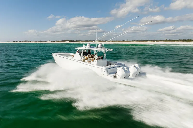  Yacht Photos Pics 2026 Barker Boatworks 40HPC speeding on open water, showcasing powerful performance.