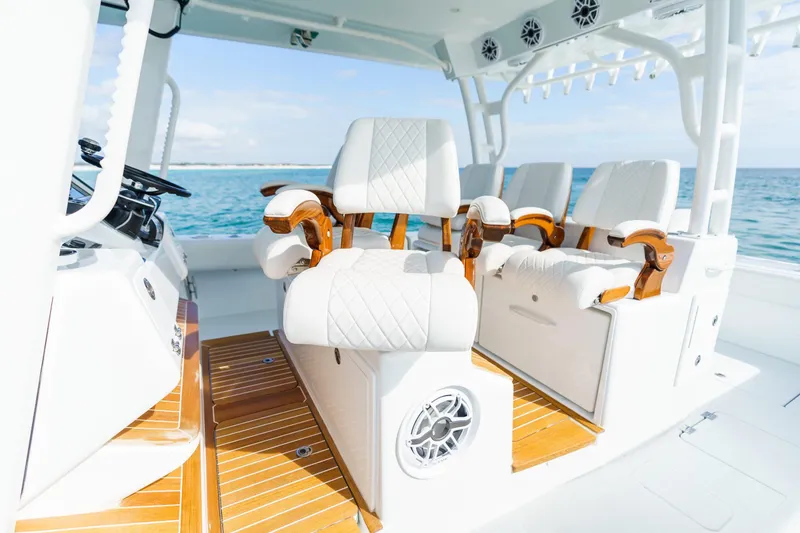 Yacht Photos Pics Luxury seating on 2026 Barker Boatworks 40HPC, featuring elegant white and wood accents.