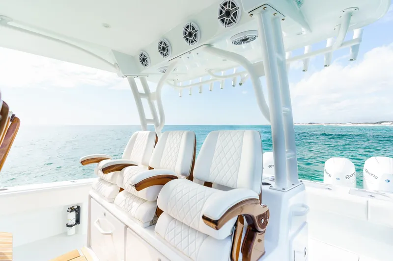  Yacht Photos Pics Luxurious seating on 2026 Barker Boatworks 40HPC, overlooking serene ocean waters.