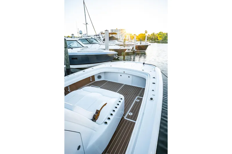  Yacht Photos Pics 2026 Barker Boatworks 40HPC docked at marina during sunset.