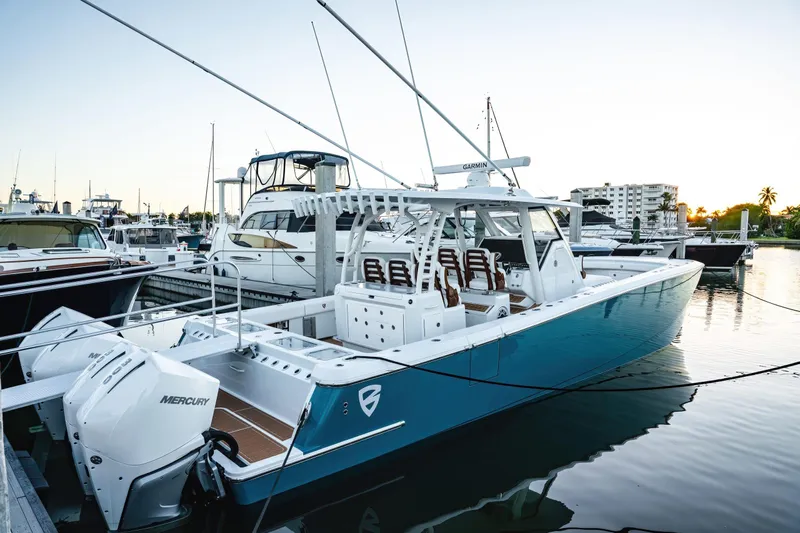  Yacht Photos Pics 2026 Barker Boatworks 40HPC docked, featuring sleek design and powerful Mercury engines.