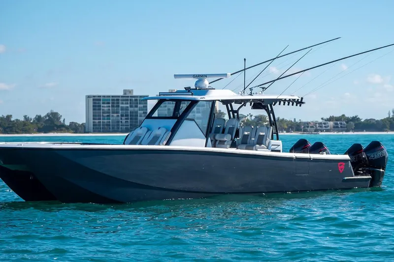  Yacht Photos Pics 2026 Barker Boatworks 40HPC on clear blue water, featuring sleek design and powerful engines.